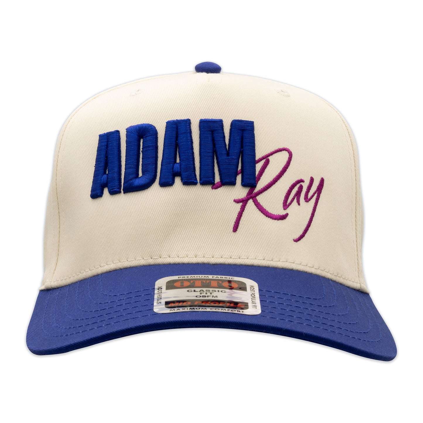 Beige and blue cap with 'Adam Ray' text on a white background
