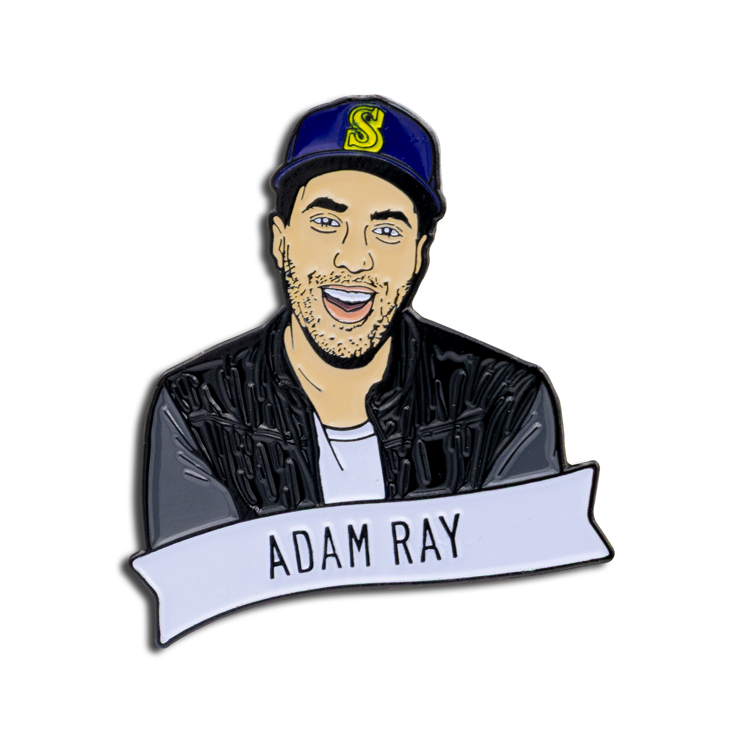 Enamel pin with a portrait of a person wearing a cap and jacket, with 'Adam Ray' text below.